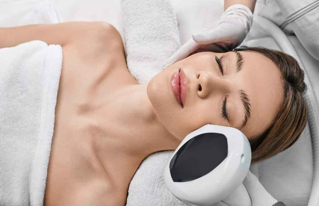Woman Receiving IPL Treatment For Her Face